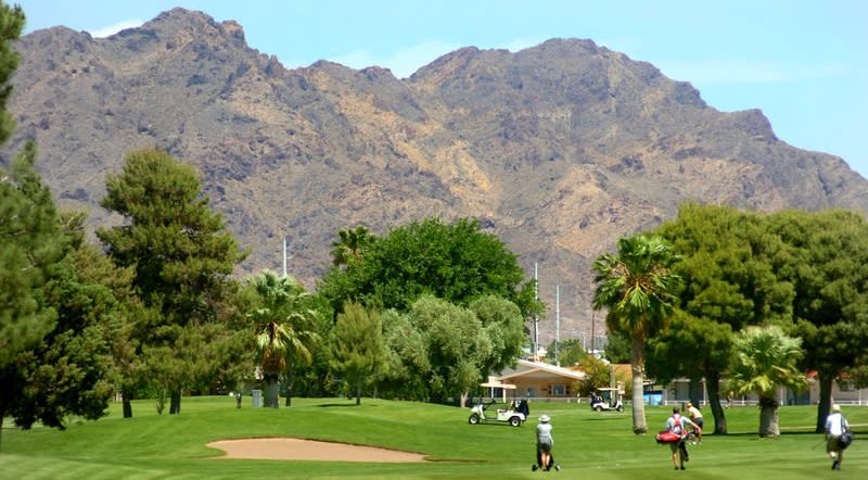 boulder-city-golf-course with mountain backdrop and golfers walking
